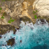 aerial-of-beautiful-cliffs-and-waves-above-the-sea-drone-footage-uluwatu-bali_sggmotoyfx_thumbnail-full02